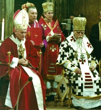 Pope John Paul II seated alongside Josyf Cardinal Slipyj in ceremonial vestments